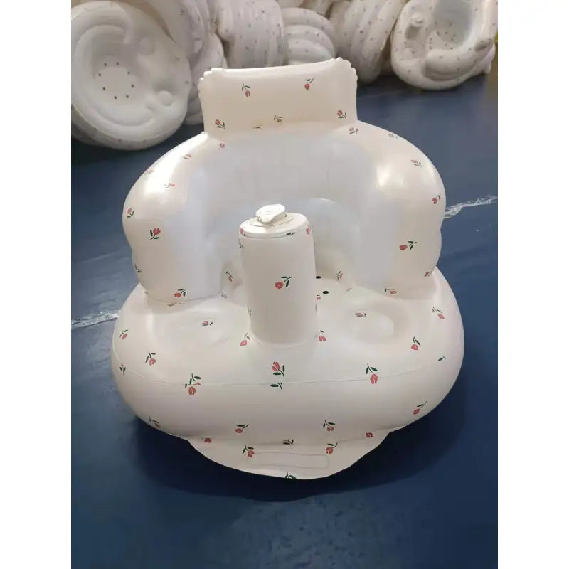 Inflatable baby chair in a bathtub with water-safe material visible