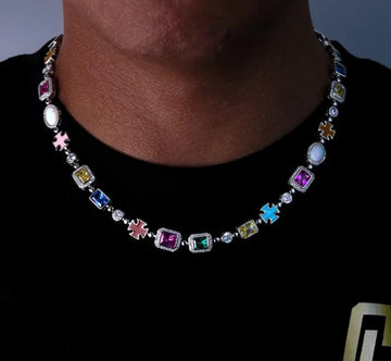 Gold-plated gemstone hip-hop style necklace on a black display