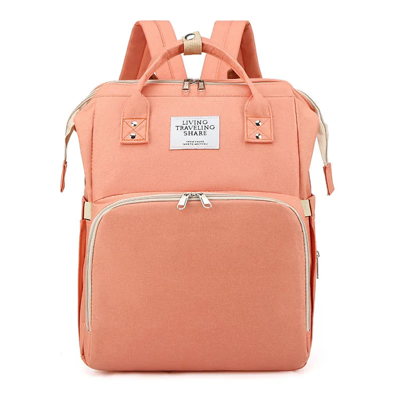 Large-capacity mommy bag open to show multiple interior pockets