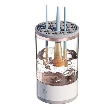 Makeup brushes being cleaned in a compact brush cleaner bowl